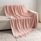 Knitted open-weave blanket