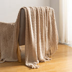 Knitted open-weave blanket